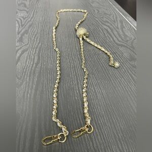 Gold purse strap in chain and white with rhinestones